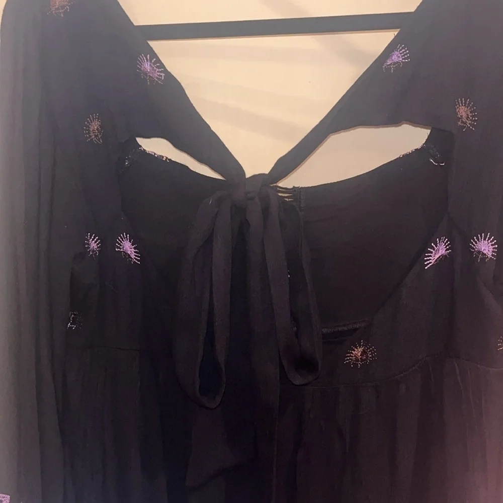 Free People black mini dress size XS with back tie and deep V bk w/ embroidery